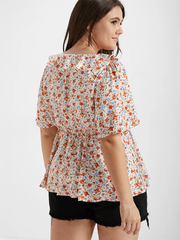 Blusa con cuello en V, volantes y lazo delantero con estampado floral